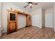 Bright room featuring wood floors and unique built-in wooden cabinets at 3890 Prairie Reserve Blvd, Orlando, FL 32824