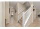 Hallway with tiled floors and a stairway leading to the second floor at 3890 Prairie Reserve Blvd, Orlando, FL 32824