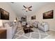 Open living room with neutral paint, tile floors, ceiling fan and stylish decor and furnishings at 3890 Prairie Reserve Blvd, Orlando, FL 32824