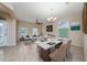 Bright, open living area featuring tile flooring, ceiling fan, and dining table with white marble top at 3890 Prairie Reserve Blvd, Orlando, FL 32824