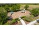 Aerial view of a community playground with swings, slides, and a protective fenced perimeter at 3890 Prairie Reserve Blvd, Orlando, FL 32824