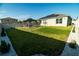 Beautiful backyard with a gazebo, volleyball net, and landscaped features for outdoor enjoyment at 400 Chayne Pl, St Cloud, FL 34771