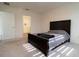 Bedroom features neutral carpet, and an ensuite bathroom with a glass enclosed shower at 400 Chayne Pl, St Cloud, FL 34771
