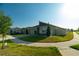 Modern single-Gathering home showcasing its manicured lawn, and contemporary architectural design at 400 Chayne Pl, St Cloud, FL 34771