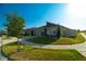 Charming single-story home with well-manicured landscaping, a two-car garage, and a welcoming front porch at 400 Chayne Pl, St Cloud, FL 34771
