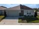 Lovely single-Gathering home featuring a two-car garage, manicured landscaping, and well-maintained lawn at 400 Chayne Pl, St Cloud, FL 34771