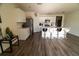 Modern kitchen with an island featuring seating, stainless steel appliances, white cabinets, and stylish flooring at 400 Chayne Pl, St Cloud, FL 34771