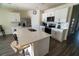 The spacious kitchen offers white cabinets, stainless steel appliances, and an island with bar stool seating at 400 Chayne Pl, St Cloud, FL 34771