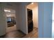 Stacked washer and dryer in laundry area next to the bedroom, maximizing space and convenience at 400 Chayne Pl, St Cloud, FL 34771