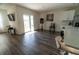 Open floorplan of living room featuring sliding glass door leading to fenced backyard at 400 Chayne Pl, St Cloud, FL 34771