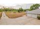 Aerial view of a property with a long driveway, pond, and three-car garage offers picturesque setting and ample parking at 4091 Lippman Rd, St Cloud, FL 34772