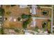 Aerial lot view shows a home, pond, and outbuildings, all enclosed by a blue boundary line at 4091 Lippman Rd, St Cloud, FL 34772
