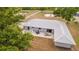 Overhead view of a house with a patio, outdoor seating, and well-maintained lawn offers a relaxing outdoor retreat at 4091 Lippman Rd, St Cloud, FL 34772