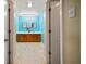 Bathroom featuring double sinks, a tiled floor and plenty of lighting at 4091 Lippman Rd, St Cloud, FL 34772