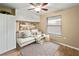 Cozy bedroom features built-in storage, ceiling fan, neutral paint, and contemporary decor for a stylish, comfortable space at 4091 Lippman Rd, St Cloud, FL 34772