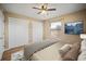 Bedroom featuring built-in closets, a large window and hard wood floors at 4091 Lippman Rd, St Cloud, FL 34772