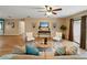 Comfortable living room featuring stylish decor, wood floors, neutral walls, and a ceiling fan at 4091 Lippman Rd, St Cloud, FL 34772