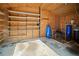 Interior of the storage building showing ample shelving and plumbing for various storage or workshop needs at 4091 Lippman Rd, St Cloud, FL 34772