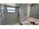 Updated bathroom featuring an illuminated mirror, updated vanity and black shower hardware at 414 Otter Creek Dr, Kissimmee, FL 34743