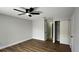 Bedroom featuring neutral paint, ceiling fan, closet and door leading to another room at 414 Otter Creek Dr, Kissimmee, FL 34743