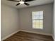 Bedroom featuring natural light from window, hardwood floors, and a ceiling fan at 414 Otter Creek Dr, Kissimmee, FL 34743