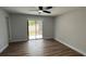 Bedroom featuring neutral paint, ceiling fan, sliding doors leading to porch at 414 Otter Creek Dr, Kissimmee, FL 34743