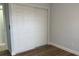 Bedroom featuring a closet and hardwood floors offering storage and style at 414 Otter Creek Dr, Kissimmee, FL 34743