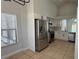 Bright kitchen with stainless steel appliances, white cabinets, and lots of light at 414 Otter Creek Dr, Kissimmee, FL 34743