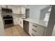 Updated kitchen features stainless appliances, white cabinetry, and a sleek countertop with pool view at 414 Otter Creek Dr, Kissimmee, FL 34743