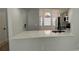 Open concept kitchen with stone countertops, stainless appliances, and a breakfast bar at 414 Otter Creek Dr, Kissimmee, FL 34743