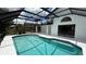 Inviting screened-in pool with clear blue water and spacious deck for relaxing and enjoying the Florida sunshine at 414 Otter Creek Dr, Kissimmee, FL 34743