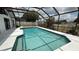 Stunning screened-in pool with refreshing, clear water, enhanced by the deck and beautiful surroundings at 414 Otter Creek Dr, Kissimmee, FL 34743