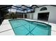 Inviting screened-in pool with clear blue water and spacious white deck for relaxing and enjoying the Florida sunshine at 414 Otter Creek Dr, Kissimmee, FL 34743