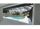 This screened-in pool boasts a pristine deck and offers a refreshing escape, blending indoor comfort with outdoor allure at 414 Otter Creek Dr, Kissimmee, FL 34743