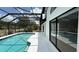 Screen enclosed pool and backyard featuring ample space for outdoor activities and privacy at 414 Otter Creek Dr, Kissimmee, FL 34743