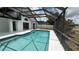 Inviting screened-in pool with crystal-clear water, poolside space, and backyard views for relaxation and recreation at 414 Otter Creek Dr, Kissimmee, FL 34743
