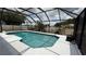 Backyard screened-in pool area featuring a clean pool with clear water and lots of space for lounge chairs at 414 Otter Creek Dr, Kissimmee, FL 34743