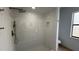 Updated shower with modern fixtures, white subway tile, and mosaic tile flooring at 414 Otter Creek Dr, Kissimmee, FL 34743