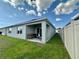 Open back patio area with comfortable chairs and sliding glass door into the home at 4373 Deleon St, Haines City, FL 33844