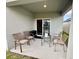 Outdoor patio featuring four chairs, small table, and a beautiful view of the backyard at 4373 Deleon St, Haines City, FL 33844