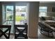 View from dining area into backyard with patio furniture at 4373 Deleon St, Haines City, FL 33844
