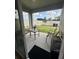 Relaxing backyard featuring a covered patio with furniture and manicured lawn at 4373 Deleon St, Haines City, FL 33844