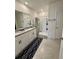Bathroom boasts double vanity, granite countertop, large mirror, and walk-in shower at 4373 Deleon St, Haines City, FL 33844