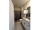 Modern bathroom featuring a granite vanity, toilet, and shower with contemporary finishes at 4373 Deleon St, Haines City, FL 33844