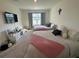 Spacious shared bedroom featuring neutral tones, two twin beds, and a large window at 4373 Deleon St, Haines City, FL 33844