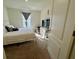 Bright bedroom features a bed, TV, dresser, and window at 4373 Deleon St, Haines City, FL 33844