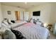 Spacious bedroom featuring two beds, a flat-screen TV, and modern decor at 4373 Deleon St, Haines City, FL 33844