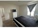 Comfortable bedroom featuring a well-lit window and neutral colors, perfect for relaxation at 4373 Deleon St, Haines City, FL 33844