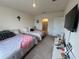 Inviting bedroom features two beds, neutral tones, and ample natural light at 4373 Deleon St, Haines City, FL 33844