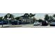 A partial view of the neighborhood clubhouse with parking lot at 4373 Deleon St, Haines City, FL 33844